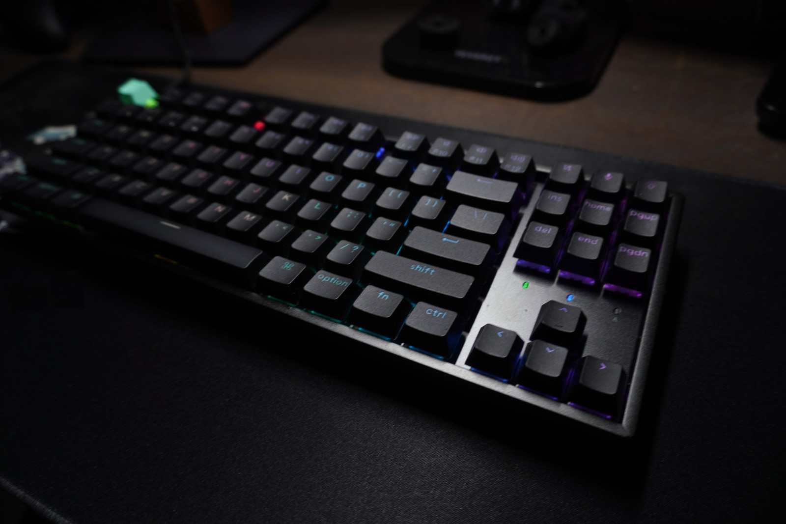 Angled close-up of the K8 HE’s arrow cluster, navigation keys, and RGB lighting on the right side.